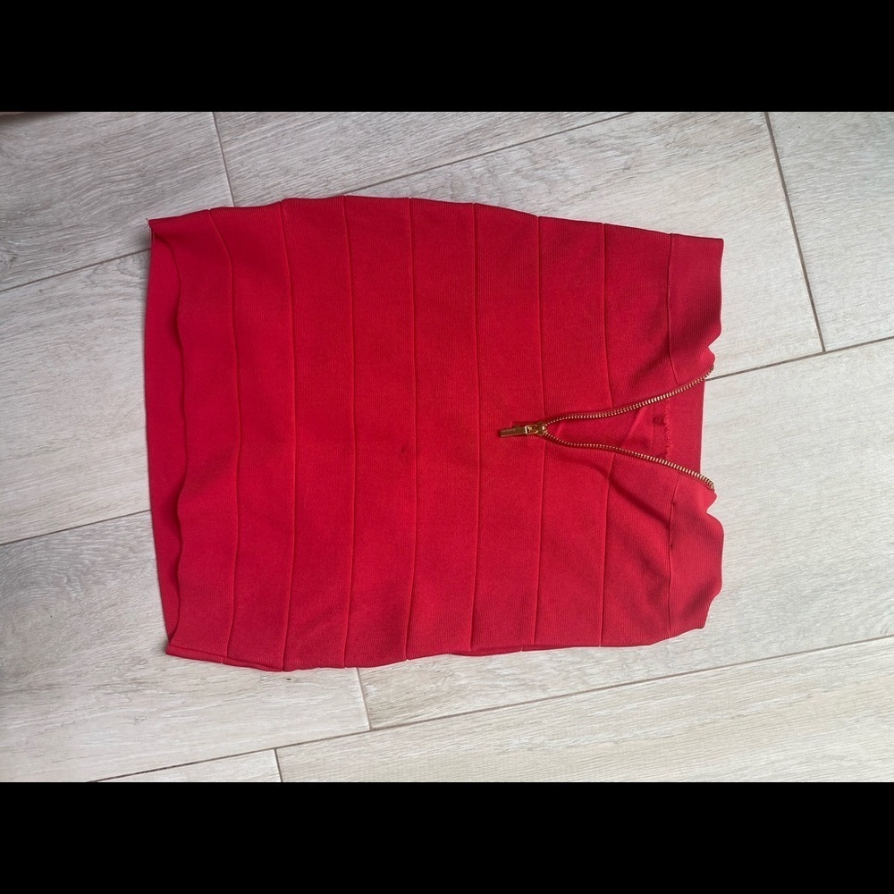 Holiday Ready with this Red knit stretch mini skirt. - Picture 4 of 5